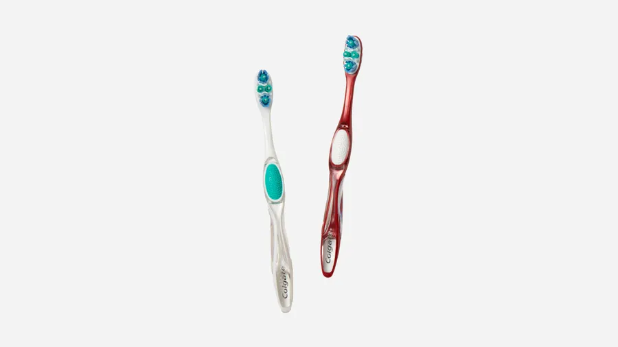 red and white colgate toothbrush