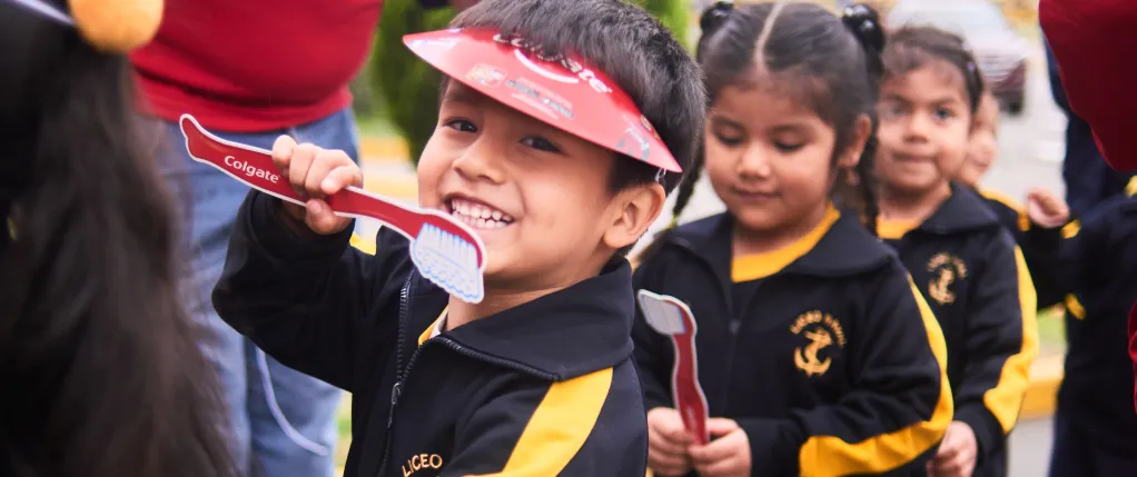 children in parade with big smiles