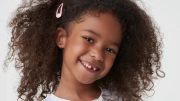 girl smiling brighly