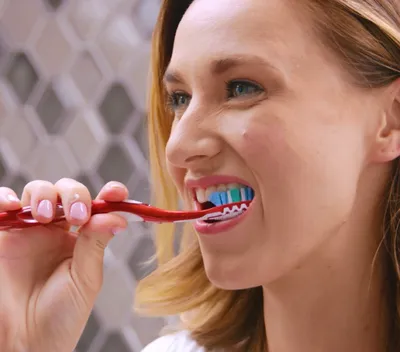 Woman brushing her teeth